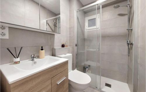 a bathroom with a shower and a toilet and a sink at Nice Apartment In Castell De La Plana With Wifi And 3 Bedrooms in Castellón de la Plana