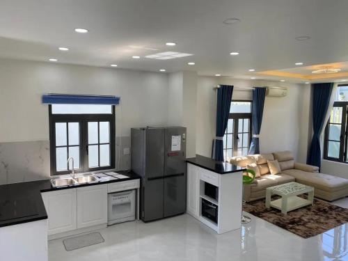 Η κουζίνα ή μικρή κουζίνα στο Novaworld Phan Thiết - Full House