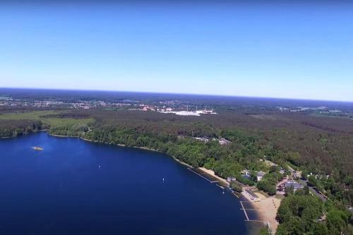 an aerial view of a beach and a lake at Sieraków - Kraina 100 Jezior in Sieraków