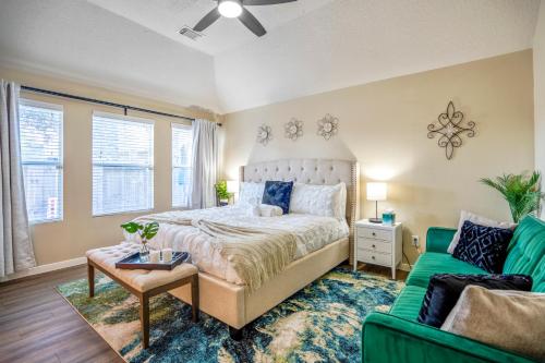 a bedroom with a bed and a green couch at Pet Friendly Home by Katy in Houston