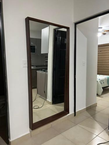a mirror on a wall in a room at ymssjamg in Mazatlán