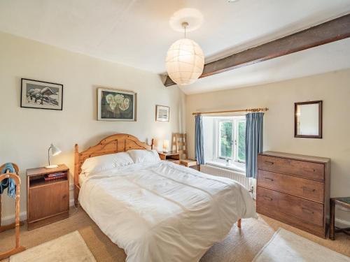 a bedroom with a large bed and a window at Waingap in Crook