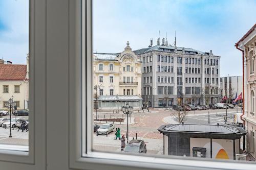 a view of a city from a window at St Casimir Apartments in Vilnius
