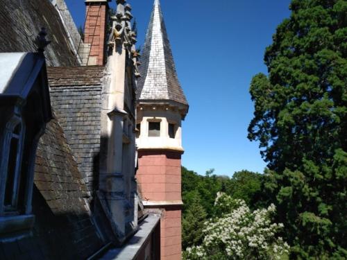 a building with a steeple on the side of it at Château de la Vernède, la Grande Vernède in Saint-Rémy-de-Chargnat