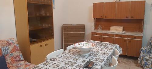 a kitchen with a table with a bowl on it at Casa della nonna Marina in Floridia