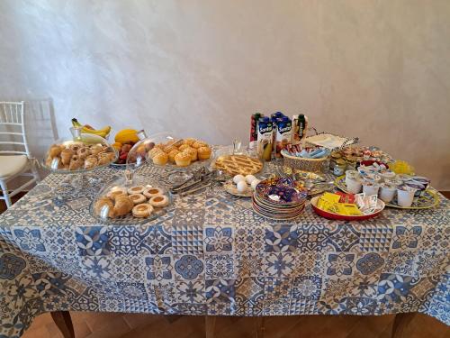 a table with a bunch of food on it at Tenuta Costa in Palma di Montechiaro