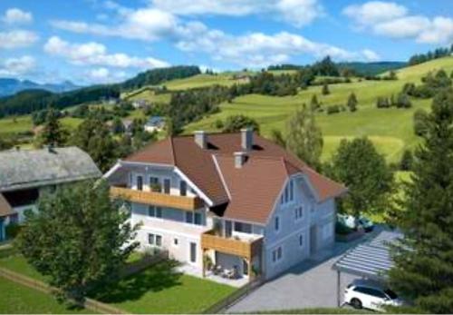 an aerial view of a large house with a roof at Ski & Alps Tamsweg in Sauerfeld