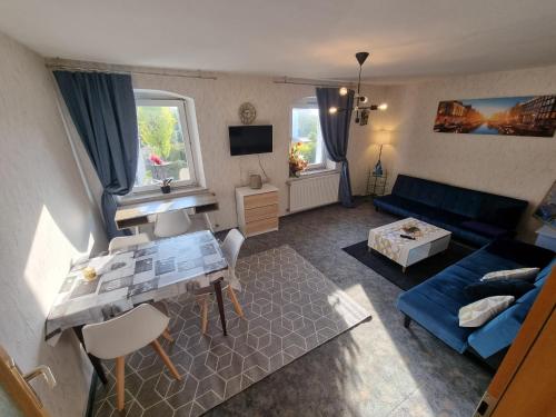 an overhead view of a living room with a blue couch at Ferienwohnung Kühnel in Zell im Fichtelgebirge