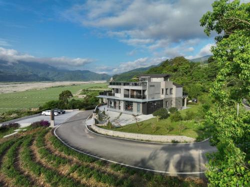 a house on a winding road with a curve at 亮院子旅墅 Bright Courtyard in Datong