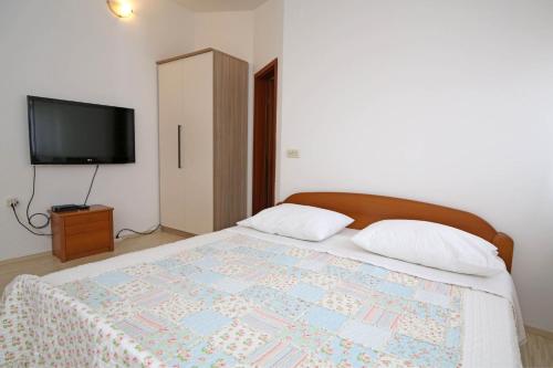 Katil atau katil-katil dalam bilik di Apartmani Krka Rooms
