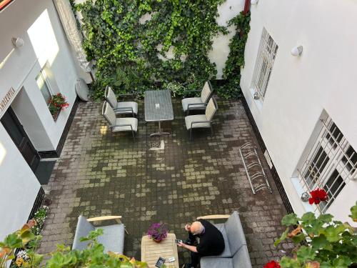 an overhead view of a man sitting at a table at GRAN hostel in Banská Bystrica