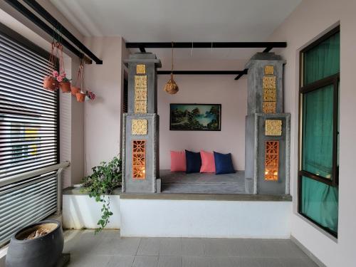 a room with a window with a bed in it at Malacca City Center Town House by 360HOME in Melaka