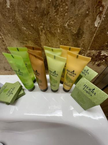 a group of four products sitting on top of a sink at Casa Eva in 2 Mai