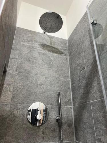 a bathroom with a shower with a glass door at Relax in montagna in Bardonecchia