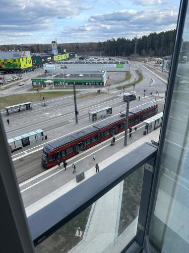 a train on the tracks at a train station at Near center w/ smart-TV, tram stop and gym visit in Tampere