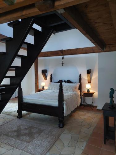 a bedroom with a large bed in a attic at Romantisches Ferienhaus in Moselnähe in Maring-Noviand