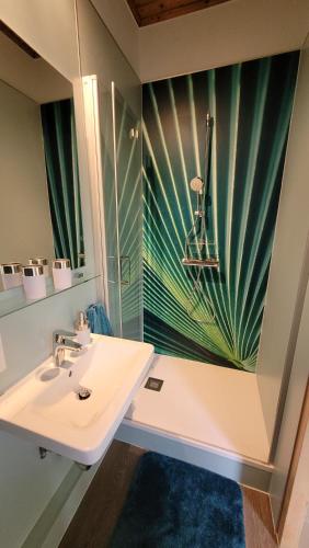 a bathroom with a sink and a mirror at Villa Blu in Sankt Kanzian