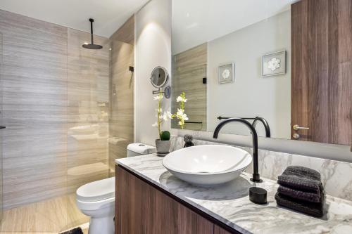 a bathroom with a sink and a toilet at Tizate Residences #136 in Cruz de Huanacaxtle