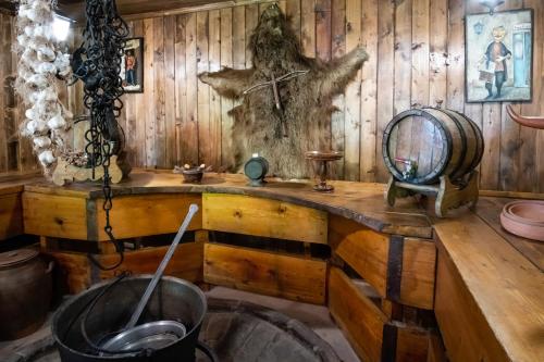 a room with a wooden wall with a wooden table at Vintage Villa Saguramo 