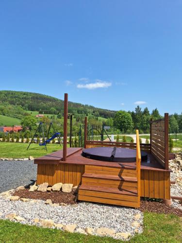 a playground in a park with a trampoline at Domki na Sudeckiej Polanie in Stronie Śląskie