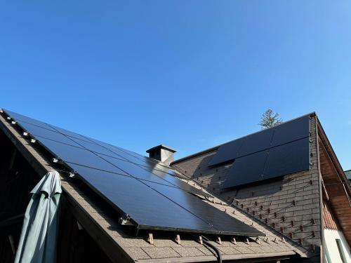 a group of solar panels on top of a roof at Ferienwohnungen Mikula-Hubacek in Bad Aussee