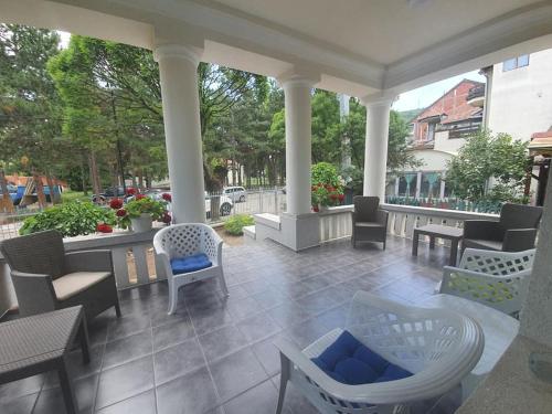 a large patio with chairs and tables at STUDIO VIK in Soko Banja