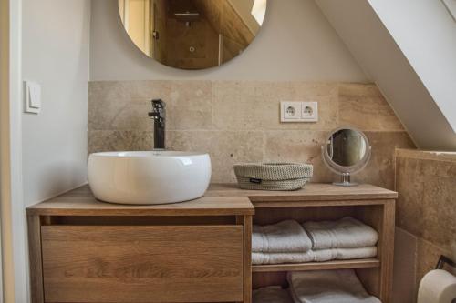 a bathroom with a sink and a mirror at Meeresblick-List in List