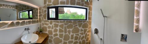 a bathroom with a sink and a window at Spring-Пролет Apartment, Old Town, Veliko Tărnovo in Veliko Tŭrnovo