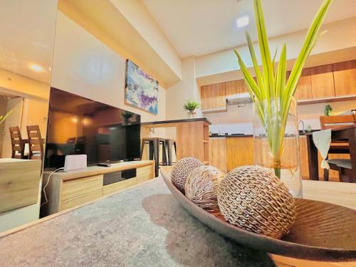 a kitchen with a table with a vase on it at * * *H Incomparable Value in Iloilo City