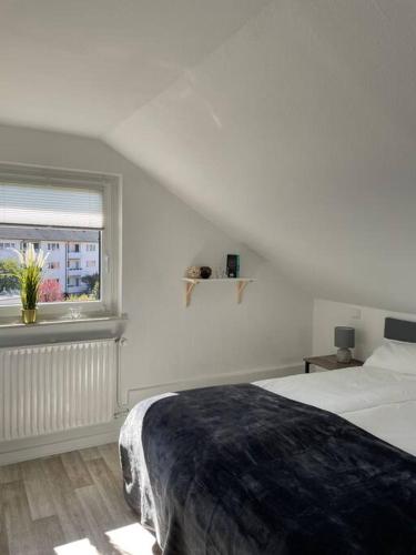 Moderne Wohnung in Bielefeld/Ummeln tesisinde bir odada yatak veya yataklar
