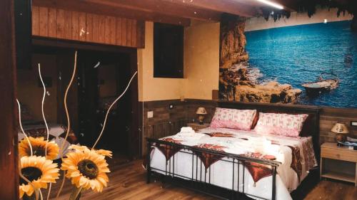 una camera da letto con un letto con girasoli di Villa Girasole a Monteroni di Lecce