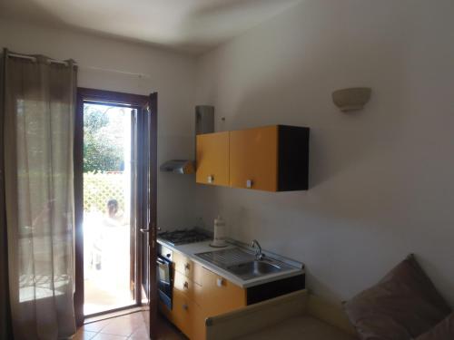 a kitchen with a sink and a counter top at Missipezza Residence a Frassanito in Alimini