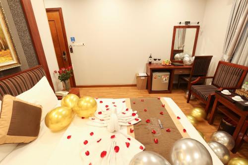 a room with a table with balloons and a table sidx sidx sidx at Gallant Hotel in Hanoi