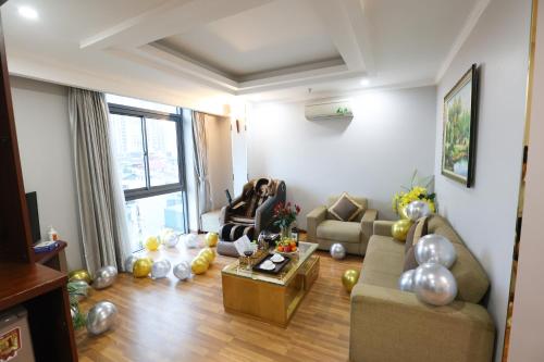 a living room with a couch and a table at Gallant Hotel in Hanoi