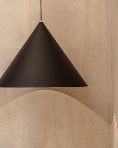a black pendant light hanging from the ceiling at Emery Hotel in Naxos Chora