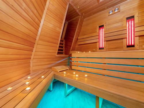 a sauna with a bench in the middle at Villa Strandblick Zingst in Zingst