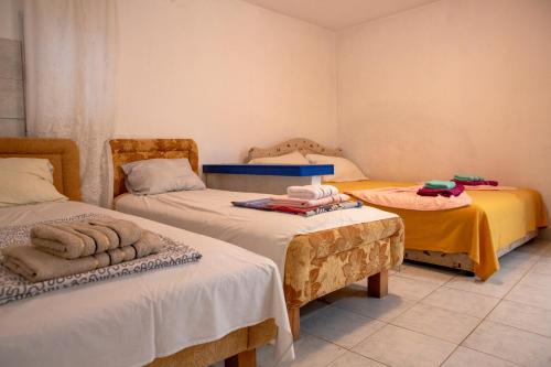 a room with two twin beds and two tables at Villa Horizon Canj in Čanj