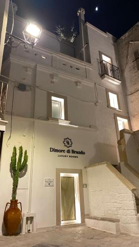 a building with a cactus in front of it at Dimore di Brando Vico Gelso in Polignano a Mare
