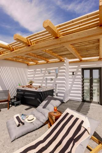 a patio with a couch and a table at Naxian Secret in Naxos Chora
