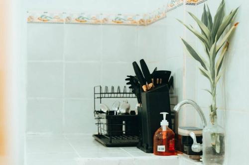 a bathroom counter with a sink and a counter top with a sink at Relaxing & Accessible Apartment in Matinkanana