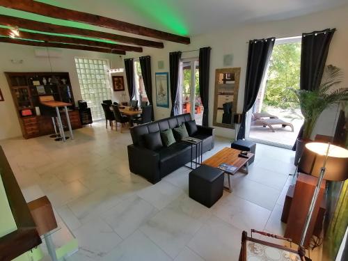 a living room with a couch and a table at The Forest House Krk 2 in Kras