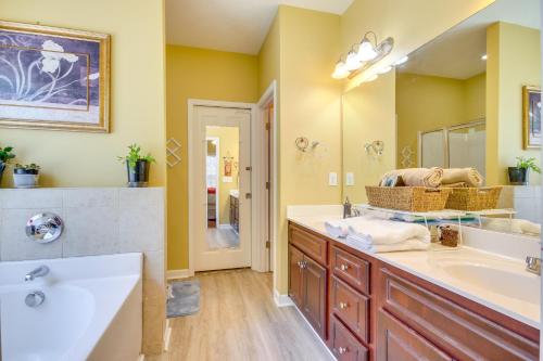 a bathroom with a sink and a large mirror at Georgia Vacation Rental 14 Mi to Downtown Augusta in Hephzibah
