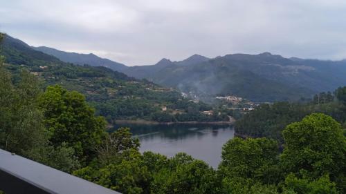 a view of a lake in a valley with mountains at Casa do Toucedo - Encanto da Natureza Caniçada / Gerês in Caniçada