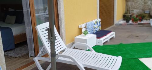 a toy house with a white chair and a desk at Casa do Toucedo - Encanto da Natureza Caniçada / Gerês in Caniçada