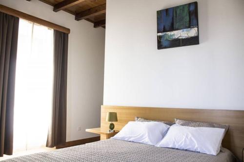 Posteľ alebo postele v izbe v ubytovaní Casa Lagar de Pedra T3