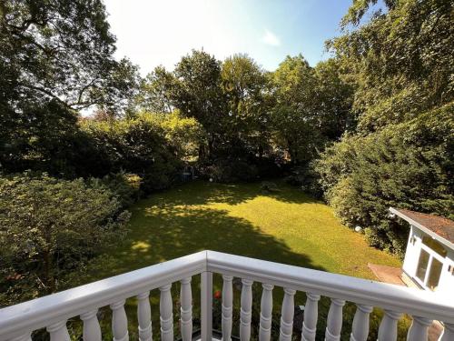 a view from a balcony of a yard with trees at Villa am Park in Bremerhaven