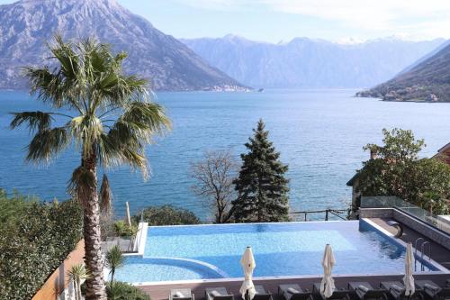 a swimming pool with a view of the water at Bellezza Resort & SPA in Kotor