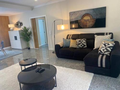 a living room with a couch and a table at Casa da Luna in Matosinhos