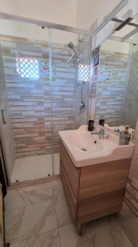 a bathroom with a sink and a shower at BILO EGADI E MONO EGADI in Favignana