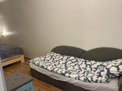 Postel nebo postele na pokoji v ubytování Papiniidu apartment